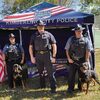 From left: Corporal Billie Kregel and K9 Ginger, Chief Todd Lemoine, and Corporal Andrew Boillot and K9 Ryker .