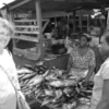 Tracey purchasing dried fish from the open market in Ghana.
